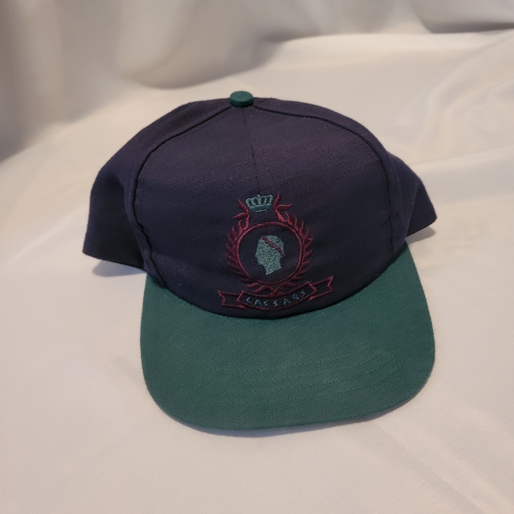 Vintage Caesars Trucker snap back hat. Blue and green exclusively caesars
